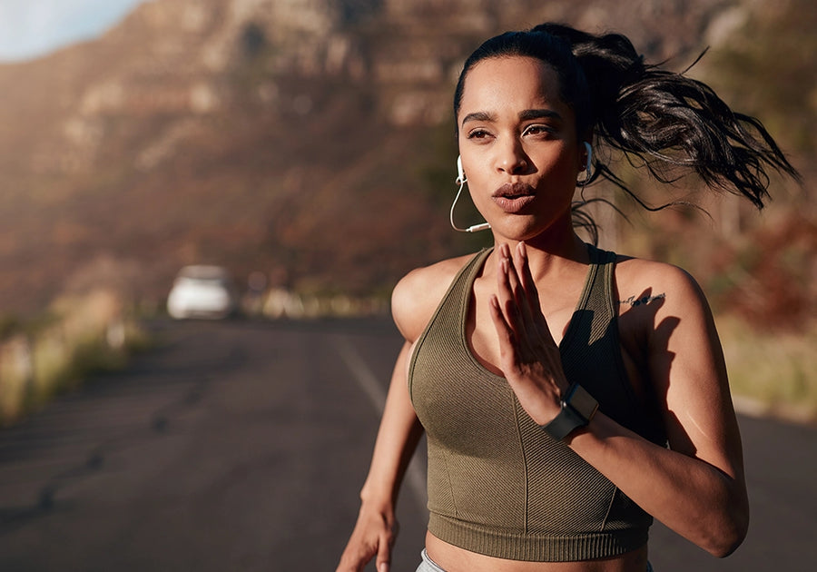 A female athlete using a women's health probiotic